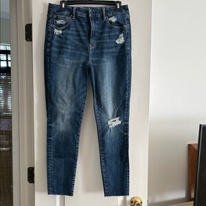 The AEO Luxe Dark Blue Distressed Jean Raw Hem EUC